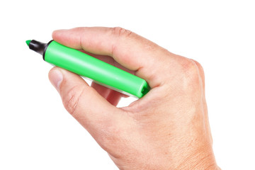 Green felt pen in a male hand for business notes.