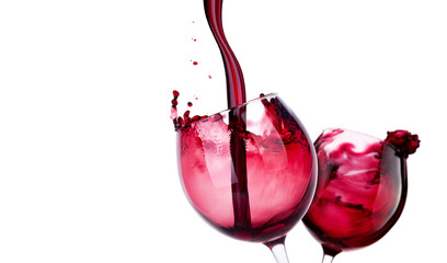 Pair of glass with red wine splash