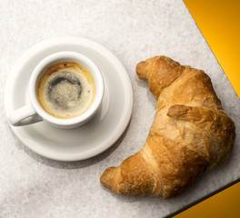 cup of coffee and croissant