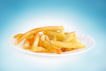 French fries potatoes on a blue background