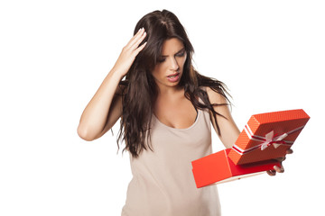 pretty girl is not happy and surprised by her gift