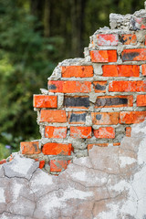 Old ruined red brick wall