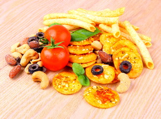 Mediterranean snack, pizza crackers, dried olives, tomatoes