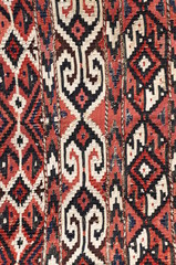 Colorful carpet with geometric pattern, textiles background