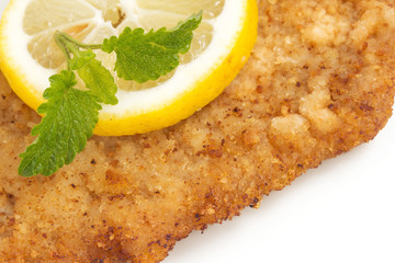 Viennese Schnitzel with lemon and lemon balm leaf