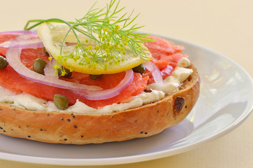 Smoked salmon lox on poppy seed onion bagel
