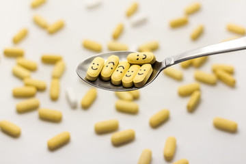 Magnesium vitamins on a spoon
