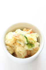 homemade potato salad on white background with copy space