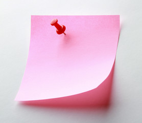 Pink paper note on white background isolated.