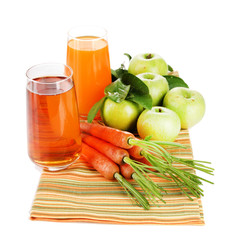 Glasses of juice, apples and carrots, isolated on white