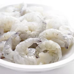 Rolgordijnen raw shrimps in a bowl © Greatstockimages