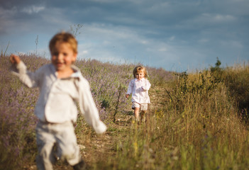 Fototapeta premium kids running down the hill