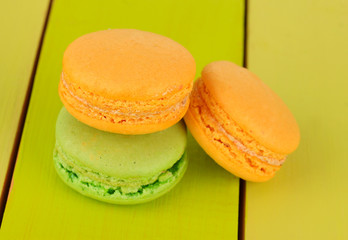 Macaroons on wooden table close-up
