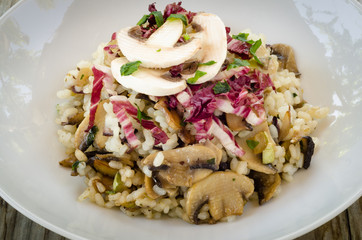 Rice with mushrooms, zucchini, radicchio and parsley