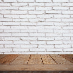 Wood table top on bricks wall.