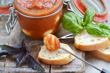 tomato marinated quail eggs in a glass jar