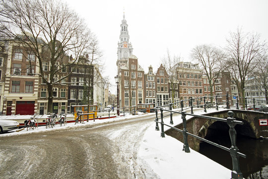 Snowy Amsterdam with the Zuiderkerk in winter in the Netherlands