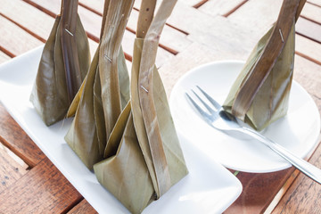 Steamed flour with coconut filling and fork