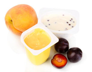 Yogurt with peach and plums isolated on white
