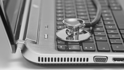 Stethoscope on laptop keyboard