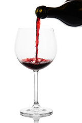 Sparkling red wine pour in glass isolated on white