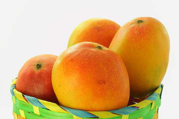 Naklejka na ściany i meble mango in basket closeup