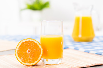 orange and a glass of orange juice