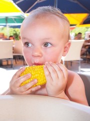 baby eating corn © Morgan