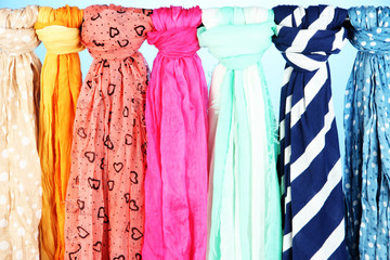 Colored scarves on blue background