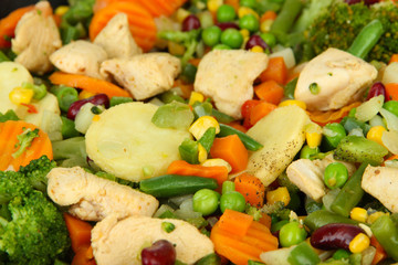 Mixed vegetables and chicken breast background
