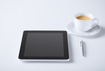 Fototapeta na wymiar tablet pc with cup of coffee
