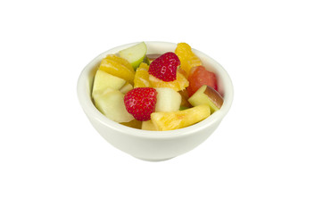 Fruit salad in a bowl on a whte background.