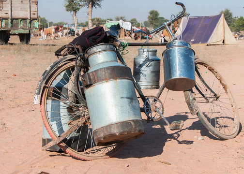 Bike with milk canisters on its side at Nagaur's cattle fair in