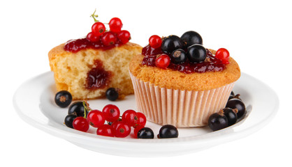 Tasty muffins with berries isolated on white