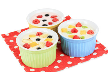 Delicious yogurt with fruit isolated on white