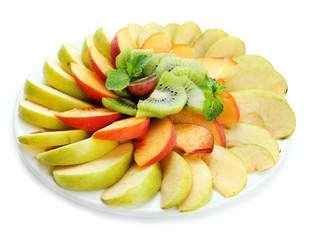 Fototapeta na wymiar Assortment of sliced fruits on plate, isolated on white