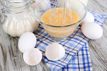 Ingredients for dough on wooden table close-up