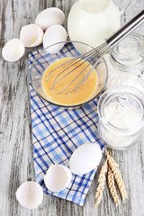 Ingredients for dough on wooden table close-up