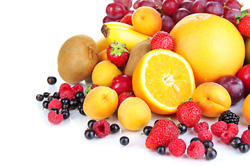 Fresh fruits and berries isolated on white