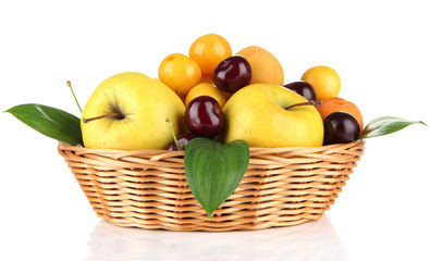 Bright summer fruits in basket isolated on white