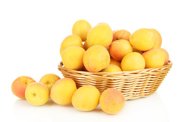 Fresh natural apricot in wicker basket isolated on white