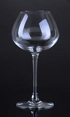 Empty wine glass on black background