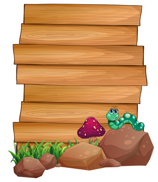Empty wooden boards near the rocks with a worm