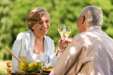 Happy seniors having picnic