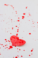 Paper heart and red splashes
