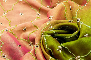 Pink and green satin textile