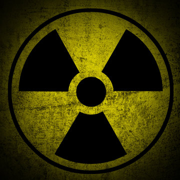 Ionizing radiation hazard symbol on grunge texture.