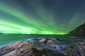 Night sea on green sky background