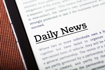 Obraz premium Daily news on tablet screen, ebook concept