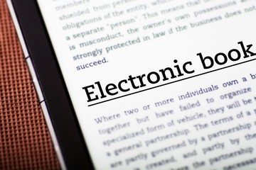 Electronic book on tablet screen, ebook concept